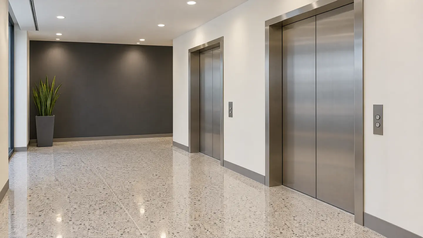 Repainted elevator lobby with a charcoal feature wall
