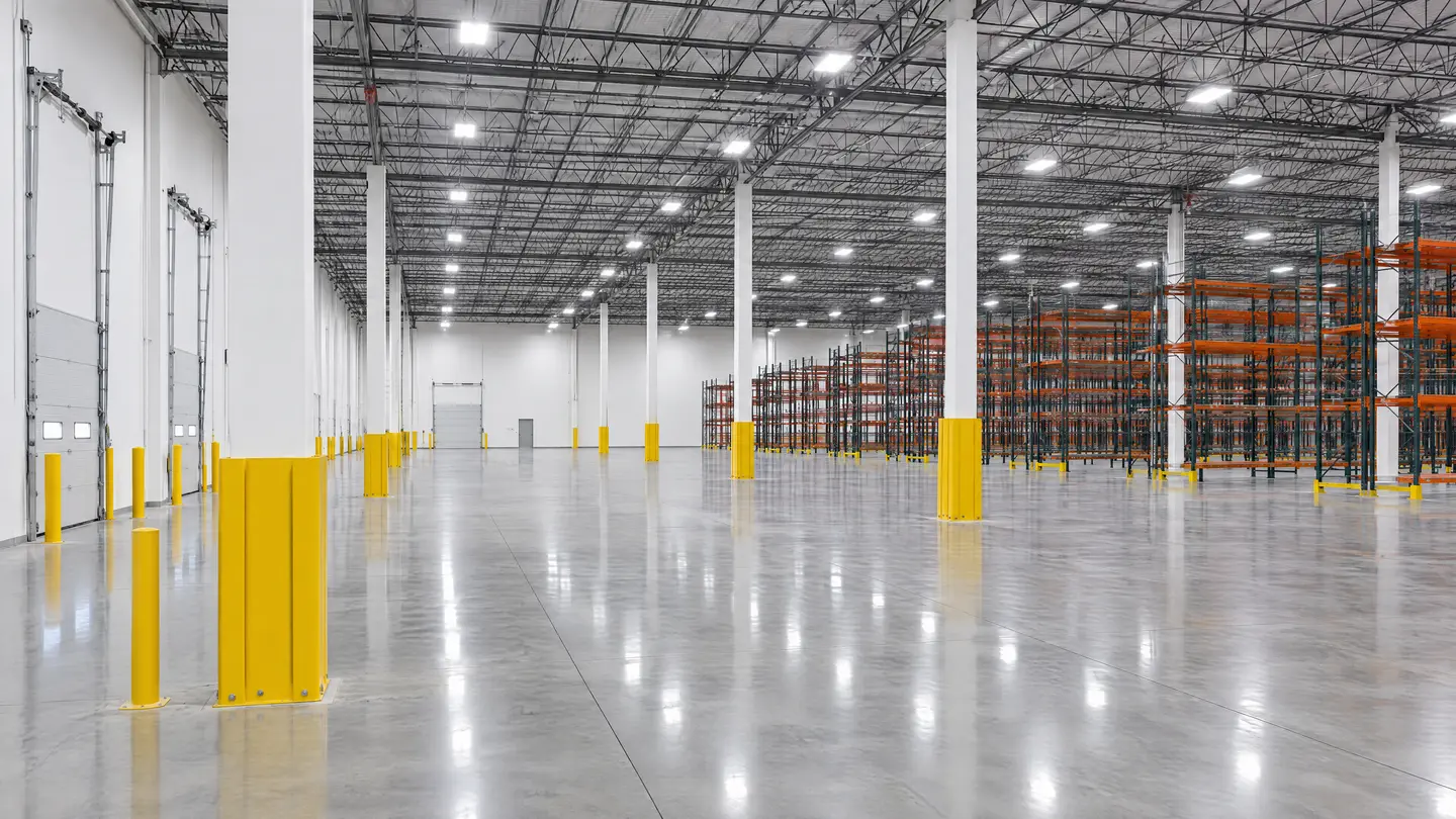 Warehouse interior with white walls and yellow column guards